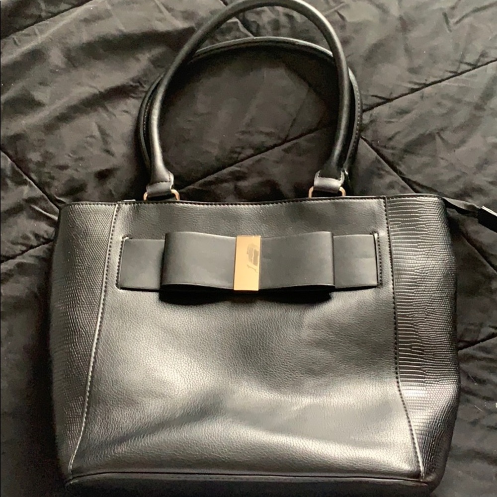 Black shoulder purse with black bow on front